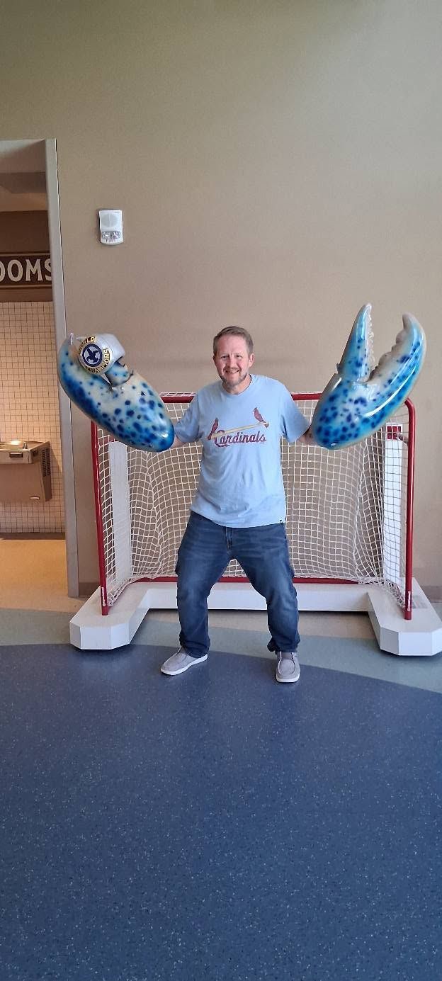 Matt posing with giant lobster claw props